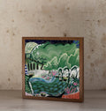 "Enchanted Forest" art print in a wooden box frame, showing a lush green forest scene with a winding blue stream and pink flowers